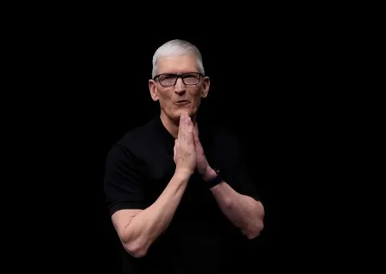 Senior Apple executive in a black outfit with hands clasped, symbolizing leadership transition as the company announces a new CEO after a long-standing tenure.