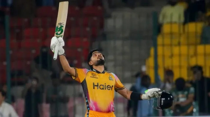 Peshawar Zalmi batter raises his bat and looks skyward in celebration after a standout innings, highlighting the team’s dominant performance in reaching the PSL 11 final.