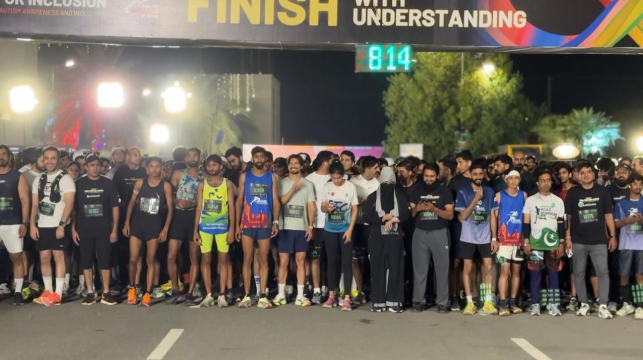 Runners gathered at the start line of Lahore’s first night run for autism awareness under Run for Inclusion event