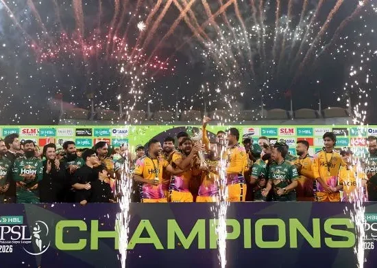 Peshawar Zalmi players and support staff celebrates with the PSL 11 trophy after beating Hyderabad Kingsmen in the final at the Gaddafi Stadium in Lahore on May 3, 2026