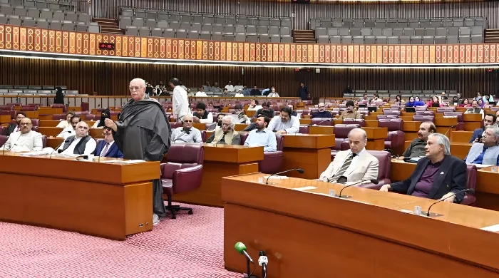 Members of the National Assembly of Pakistan seated during the Budget 2026–27 session as Finance Minister Muhammad Aurangzeb presents the federal budget in Parliament.