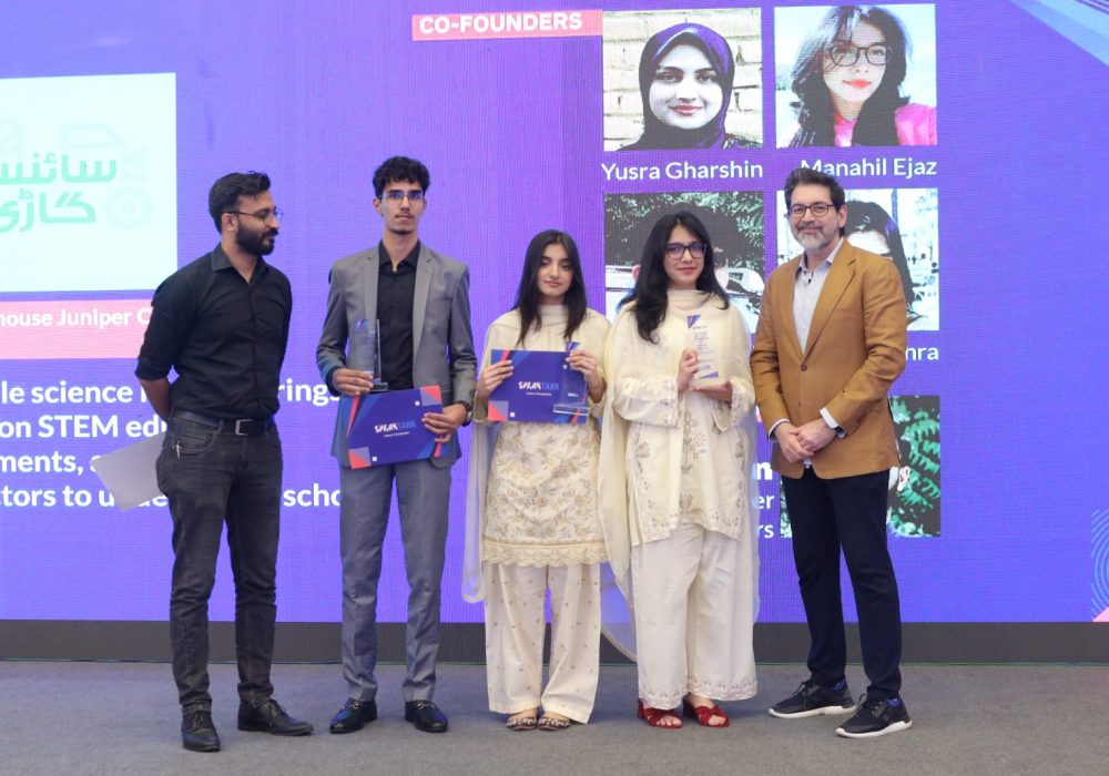 Students receiving certificates and recognition at the SparkTank Cohort 3 graduation ceremony in Lahore, showcasing young entrepreneurs alongside mentors and Beaconhouse leadership during the startup showcase event.