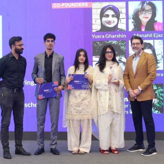 Students receiving certificates and recognition at the SparkTank Cohort 3 graduation ceremony in Lahore, showcasing young entrepreneurs alongside mentors and Beaconhouse leadership during the startup showcase event.