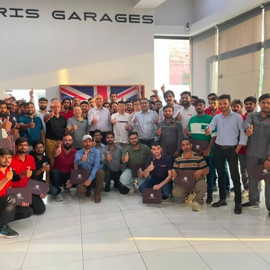 MG Motor Pakistan dealership technicians receiving hands-on hybrid vehicle battery training as part of nationwide after-sales readiness for MG HS Hybrid+ and MG HS Super Hybrid.