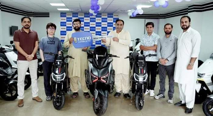 TECNO Pakistan TikTok Challenge winners receive REVOO electric bikes at the CAMON 50 Series event.